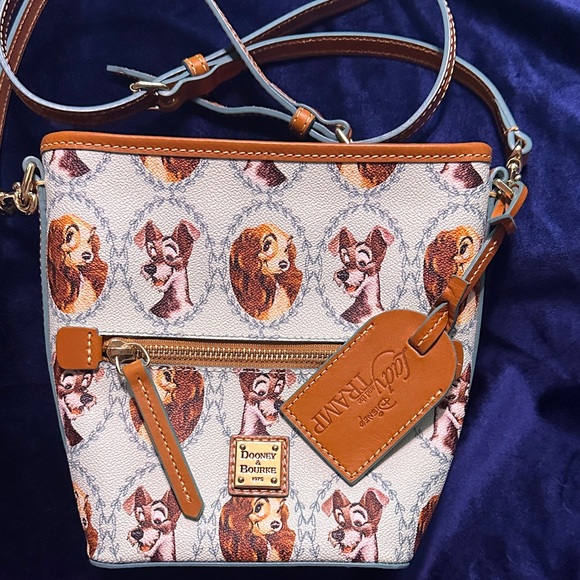 Dooney & Bourke Handbags - Disney Dooney & Bourke Light Blue and Tan Lady & the Tramp Crossbody Bag